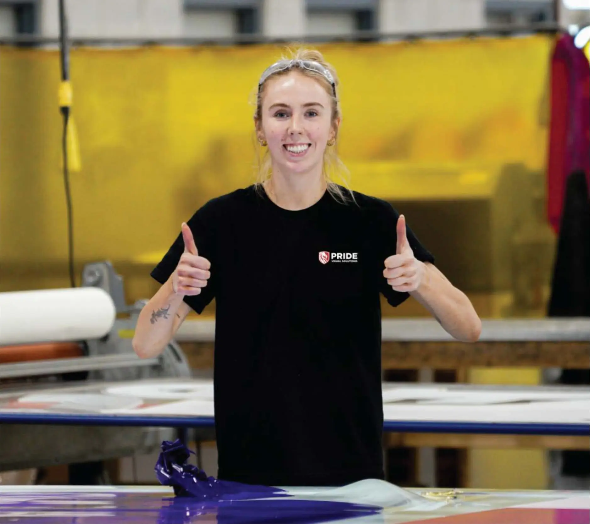 Smiling Pride Visual Solutions production team member giving two thumbs up