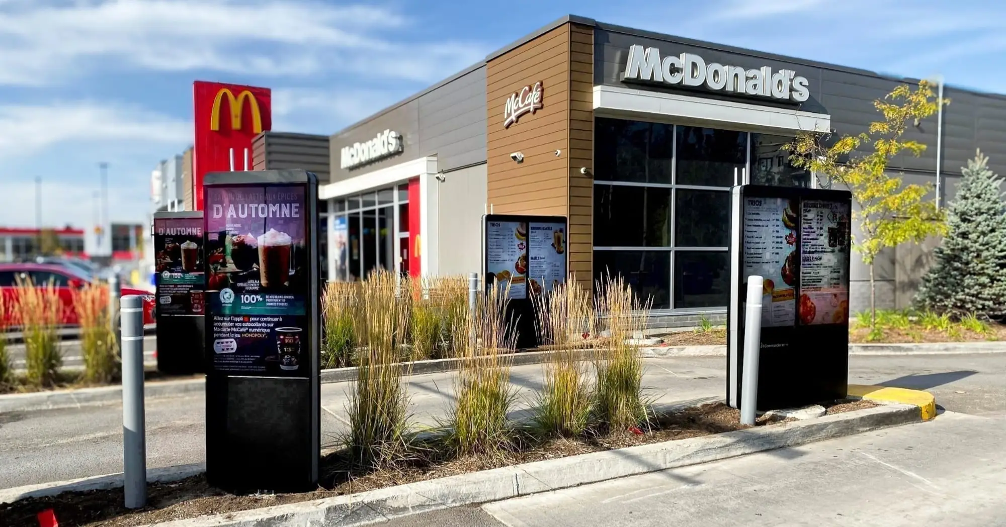 Digital menu boards and pre-sell display outside a rebranded McDonald’s restaurant
