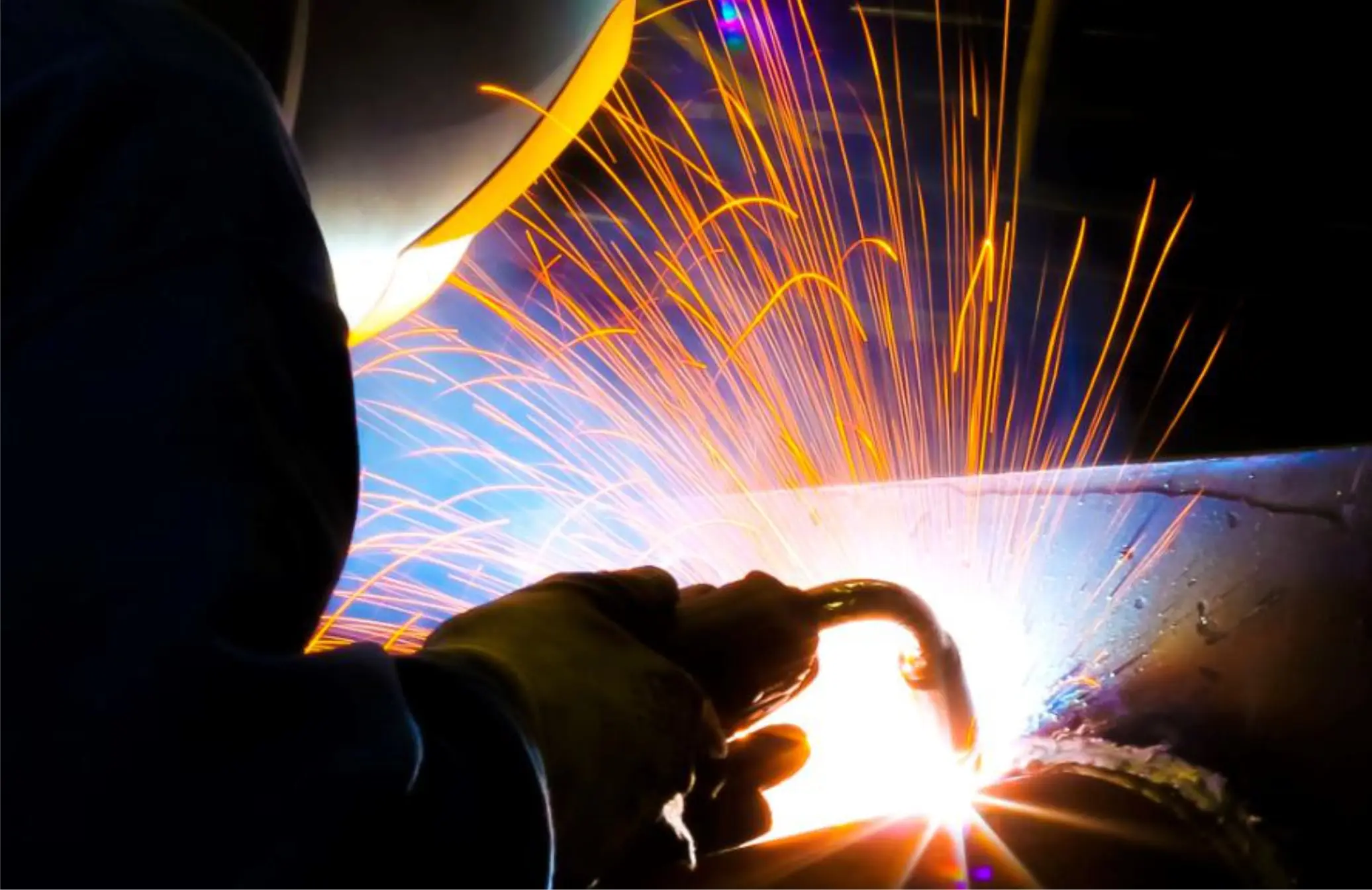 Welder joining a sign frame in the Pride Visual Solutions fabrication shop