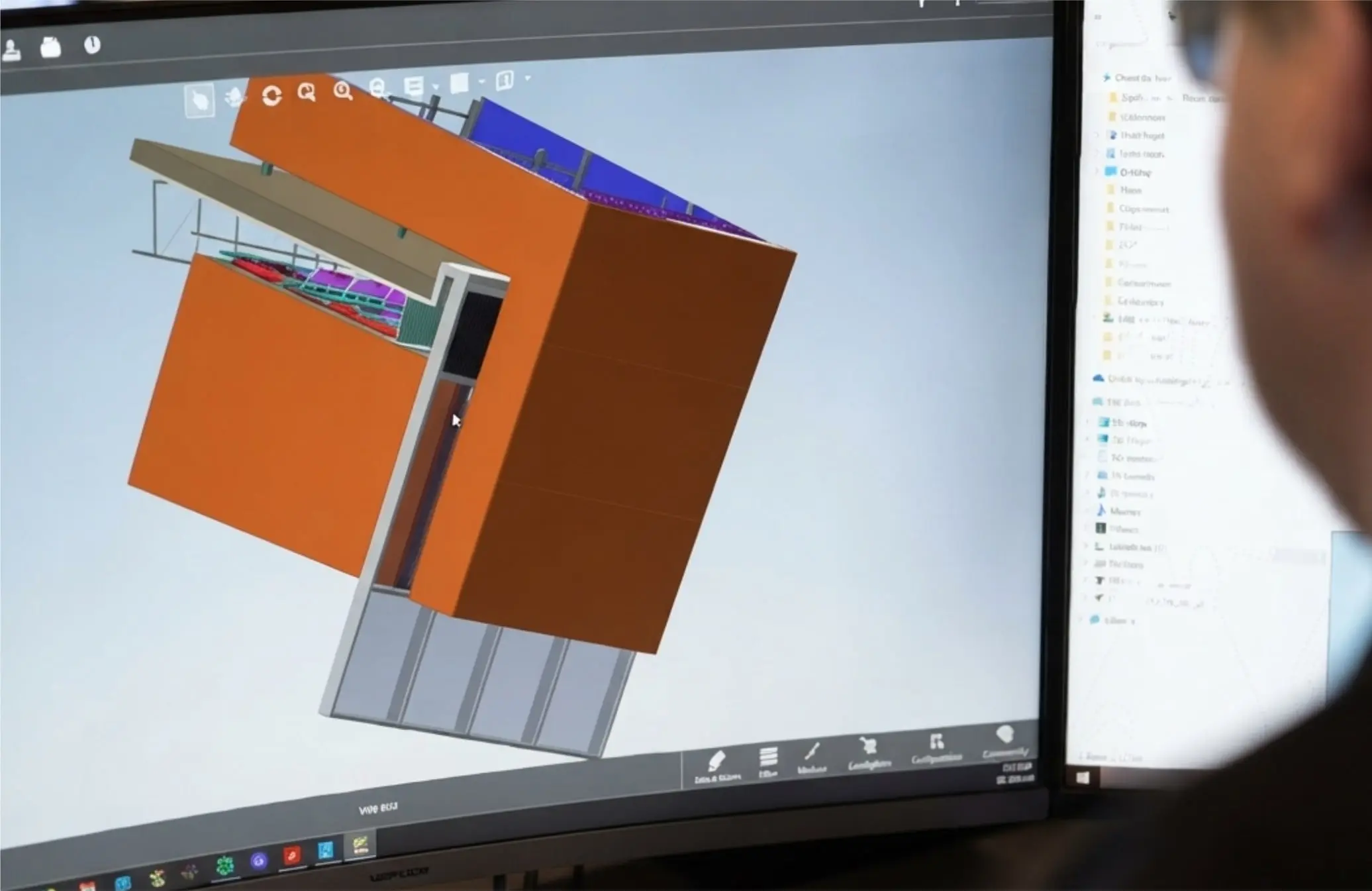 Engineer modelling a sign structure in 3D CAD on screen